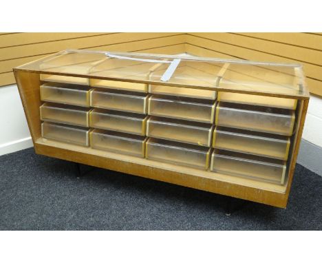 A late twentieth century light wood and glass retailer's counter display raised on a metal base with corner supports and cont