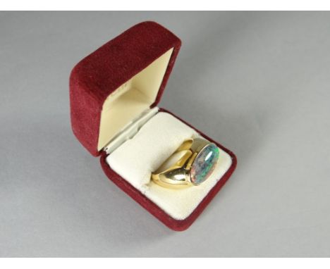 An Australian 18k gold (marked 750) gent's ring, set with a large opal, approx 2.15 cms long