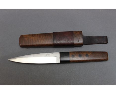 Hunters International limited edition fixed blade spear point knife, with 4½" blade with hidden tang and wooden scales, with 