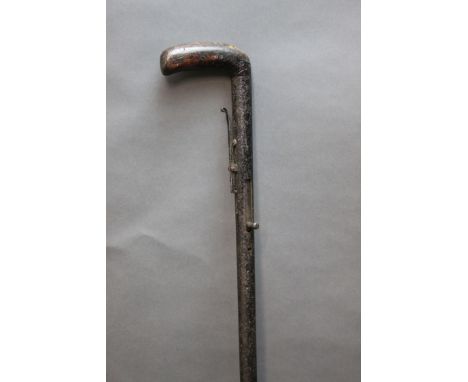 Percussion muzzle loading walking stick shotgun, wooden handle.  Length 94 cm.  NO LICENCE REQUIRED  CONDITION REPORT: The gu