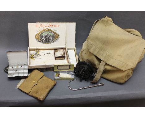 A vintage bag containing a Jector Mk 2 trout fly reel, various tins and boxes containing vintage tackle, fly cast wallet etc.