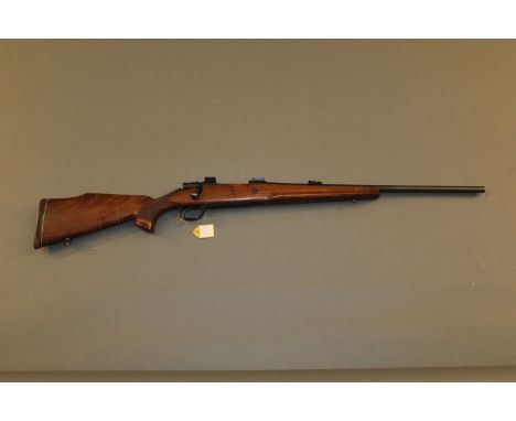 A Parker Hale Winchester bolt action rifle, .243, with 22" barrel and floor plate magazine , decorated with a bighorn ram.  S