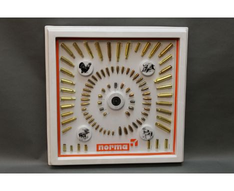 A Norma shop display ammunition board, 43 cm x 43 cm, framed.