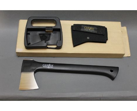 A Gerber axe made by Fiskars, blade length 7 cm, comes with sheath, box etc.