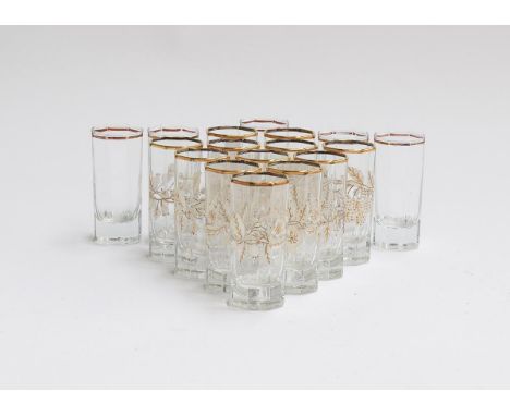 A set of 12 gilt and enamel octagonal shot glasses; together with six further clear glass shot glasses (18) 