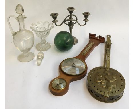 A mixed lot to include a brass chestnut roasting pan; green glass float; candlestick holder; engraved decanter  etc 