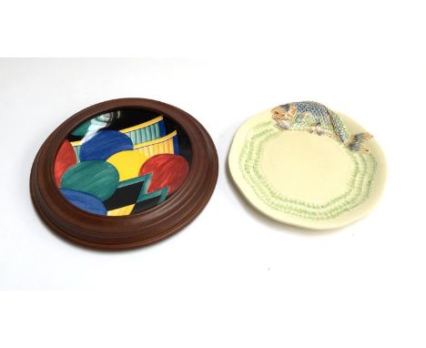 A Clarice Cliff plate, c.1930s, marked 'Wilkinsons Ltd England', hand painted with a stylised leaping fish, 22cmD; together w