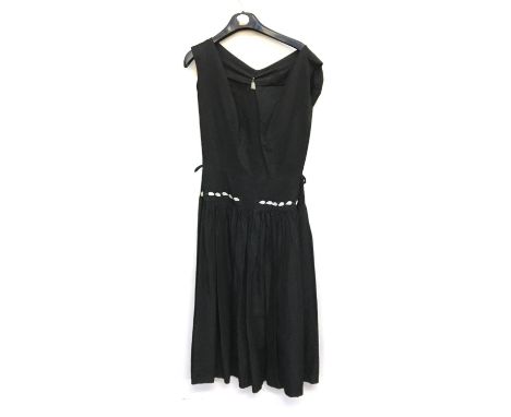 A vintage black dress, approx. size 10; together with a vintage dress with scarf and long evening gloves in pink, approx. siz