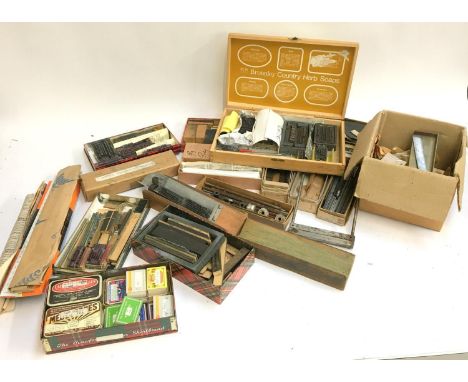 A very large lot of lead type and type setting related items to include leads, rules and furniture, several compositors slide