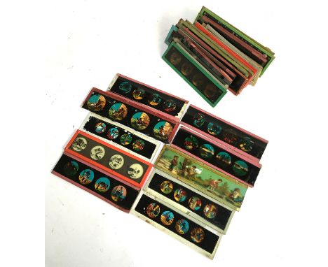 A collection of approximately 40 glass magic lantern slides, mostly depicting nursery rhyme stories and children's characters