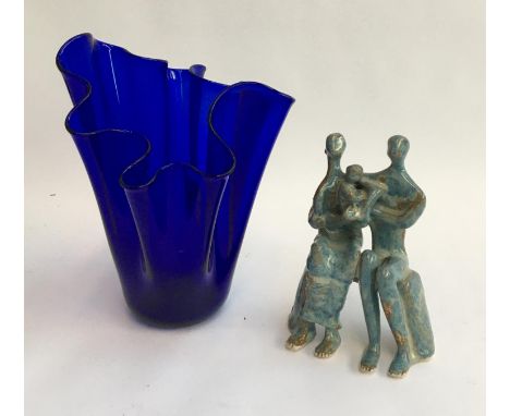 A blue art glass vase, 27cmH; together with a studio ceramic figure of parents with child, 18.5cmH 