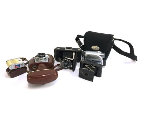 A mixed lot of photographic equipment to include a Kodak bellows camera with Anastigmat 1-6.3 105mm lens; another Kodak bello