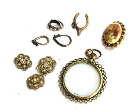 A yellow metal picture pendant, small horseshoe charm, small enamel painted brooch and others 