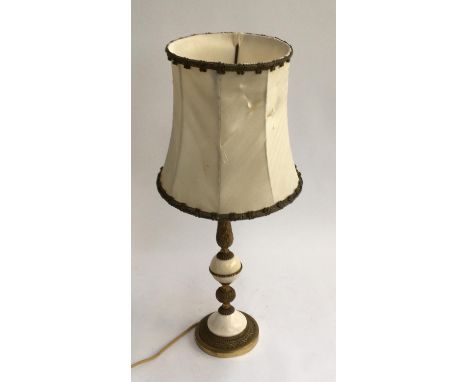 A gilt metal and marble table lamp 