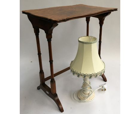 A quarter veneer burr walnut occasional table, 53cmH shaped top, together with a white painted carved table lamp 