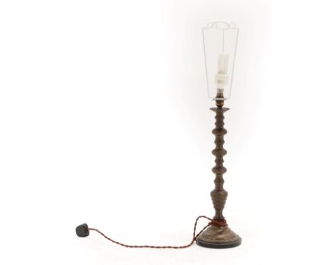 An Ottoman Gilt Brass Candlestick, late 19th/early 20th century, of multiple knopped form, on a stepped domed base, 48.5cm hi