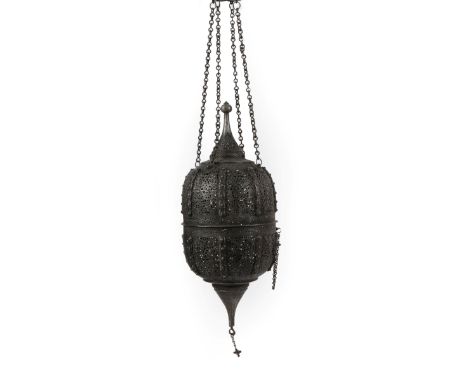 A Steel Mosque Lamp, 19th century, of ovoid form with minaret finials, cast and pierced with scrolling foliage within strapwo