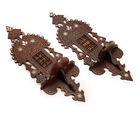A Pair of Damascus Mother-of-Pearl Inlaid Hardwood Turban Stands (Kavukluk), late 19th century, with foliate finials and arch