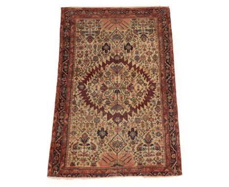 Mustafi Feraghan Rug West Iran, circa 1890 The cream field with serrated medallions framed by flowerheads and angular plants 