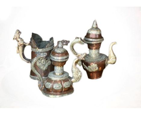 A Tibetan White Metal Mounted Copper Tea Service, late 19th/early 20th century, of baluster form with mythical beast handles 