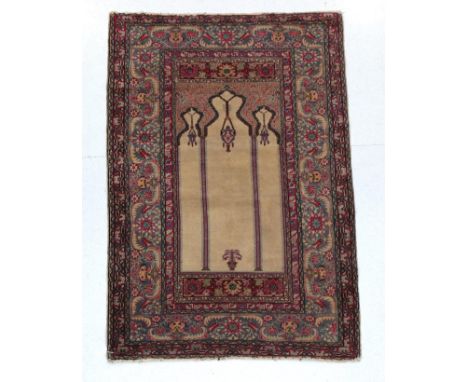 Ladik Prayer Rug Central Turkey, 20th century The ivory field with lamp beneath the Mihrab enclosed by pale indigo borders, 1