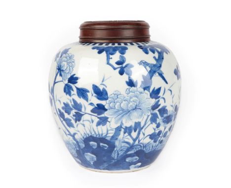 A Chinese Porcelain Ginger Jar, Kangxi, of ovoid form, painted in underglaze blue with a bird amongst flowering branches, 20c