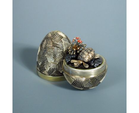 A silver gilt 'Surprise Egg', by Stuart Devlin, London 1979,   the ovoid body with textured finish opening to reveal a turtle