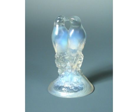 Deux Tourterelles, an R. Lalique opalescent glass paperweight, etched R. Lalique mark and numbered 1128 12.50cm (5in)  In goo