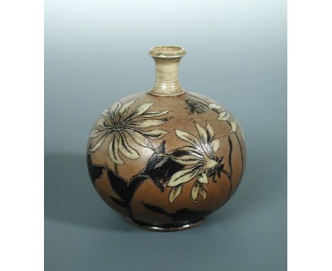 A Martin Brothers stoneware stoneware vase, of squat baluster form with slender ring turned neck, the body decorated with dah