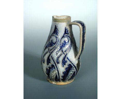 A Martin Brothers stoneware jug, incised and glazed in dark blue to a paler blue ground, inscribed to underside '134, R. W> M