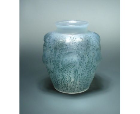 Domremy, an R. Lalique glass vase, with blue highlights, etched R. Lalique marks and numbered 979 22cm (9in)  In good conditi