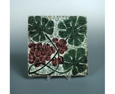 William de Morgan, a large Sand's End tile, painted with vine leaves and grapes, impressed mark 20 x 20cm (8 x 8in)  