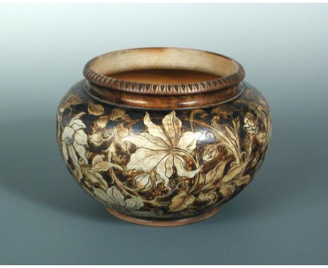A Martin Brothers stoneware jardiniere, the bulbous body with moulded and incised rim, the body with foliate decoration, insc