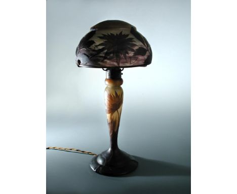 Daum, Nancy, a good cameo glass table lamp, circa 1910, with wrought iron fittings, the shade signed in cameo Daum Nancy with