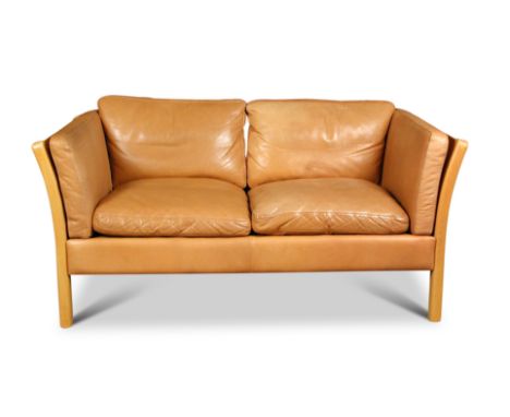 Stouby, a Danish cognac leather two-seater sofa, the beech frame with outswept arms 64 x 145 x 80cm (25 x 57 x 31in)  