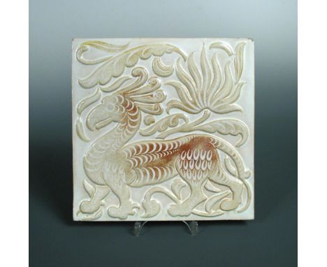 William de Morgan, a large ruby lustre relief animal tile, circa 1895, with a mythical beast surrounded by stylised palmettes