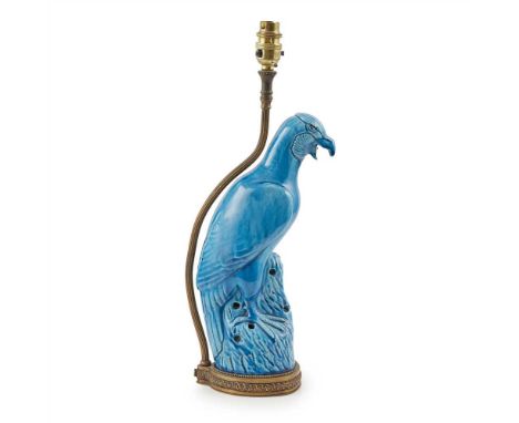                perching on a pierced rock, converted to a lamp, mounted on a brass stand, a brass pole for wiring ascends fro