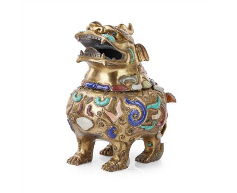         In standing position, the beast's horned head with flaring nostrils and a wide opened mouth, the hollow body cast wit