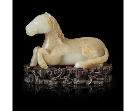               in recumbent pose, depicted with two rear legs tucked underneath its body and two front legs half raised again