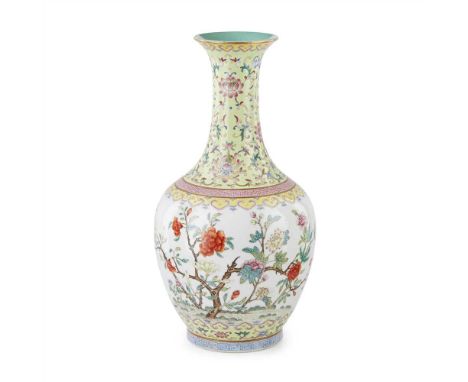           the bulbous body finely painted with peony and magnolia trees, the tall slender neck fully decorated with lotus in