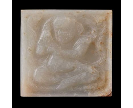                carved in relief to one side with a musician, possibly of Central Asian origin, seated on an oval mat playing 