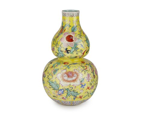                 painted in vibrant colours with a variety of seasonal flowers including lotus and hibiscus borne on scrolling