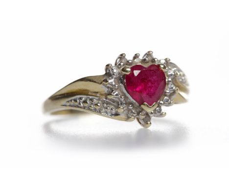 RUBY AND DIAMOND CLUSTER RING
the central red heart shaped ruby surrounded by diamonds, on diamond set shoulders, in nine car