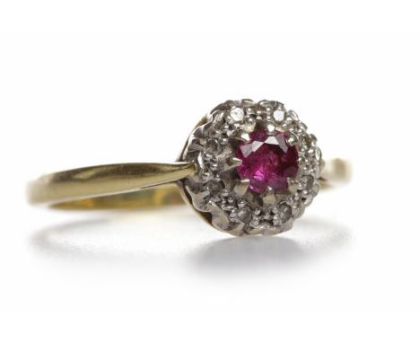 CREATED RUBY AND DIAMOND CLUSTER RING
the round cut created ruby 3.75mm diameter, surrounded by round brilliant cut stones to