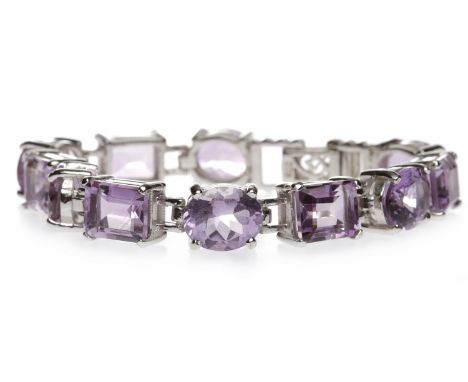 SILVER AMETHYST SET BRACELET
set with oval amethysts 11mm long alternating with emerald cut amethysts 10mm long, 16.5cm long,