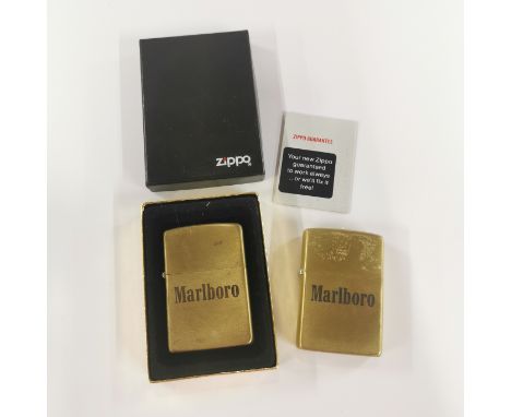 Two Marlboro zippo lighters.