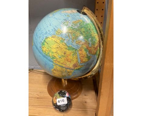 A vintage globe, H. 37cm. Together with a globe paper weight.