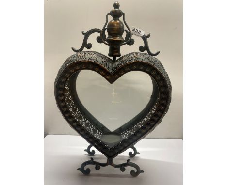 A heart shaped metal storm lantern, H. 52cm.