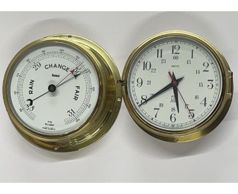 A Sestrel ship's style barometer with a smiths ship's style clock, dia 20cm.