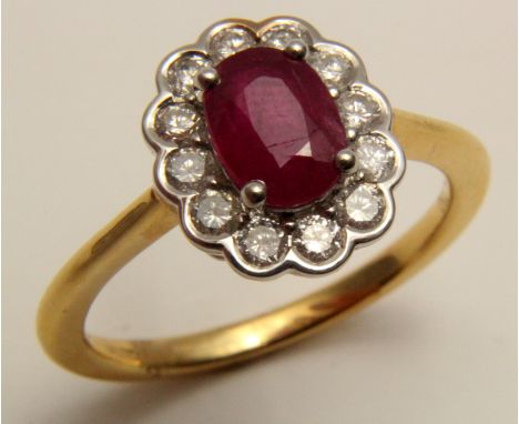 18ct Gold Ring set with central Ruby 1.06 ct weight and surrounded by Diamonds 0.43 ct weight size M weight 4.3 grams